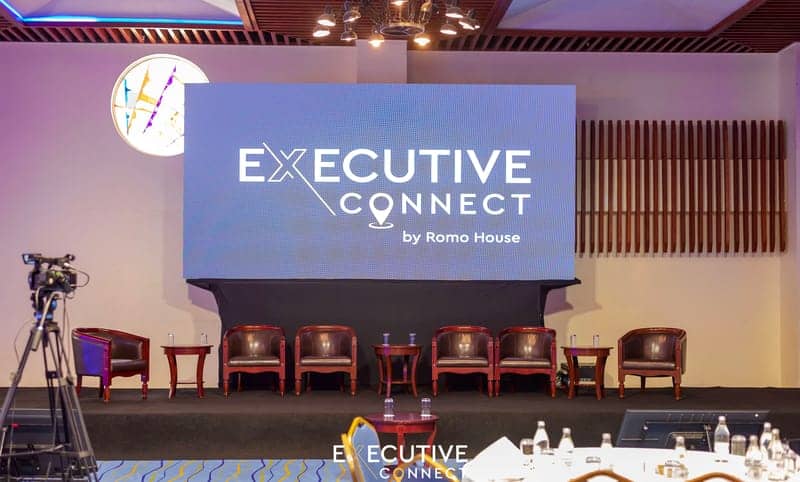 Cover of the Executive Connect album: an Executive Connect by Romo House LED stage with armchairs