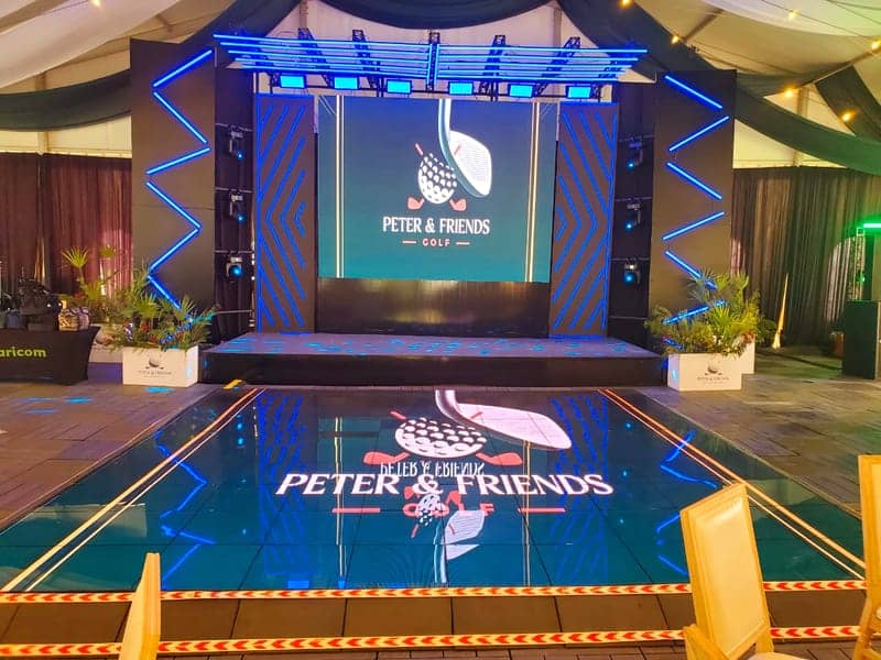 Cover of the Peter & Friends Golf album: a blue-lit LED stage with the Peter & Friends Golf logo and a mirror-tile dance floor