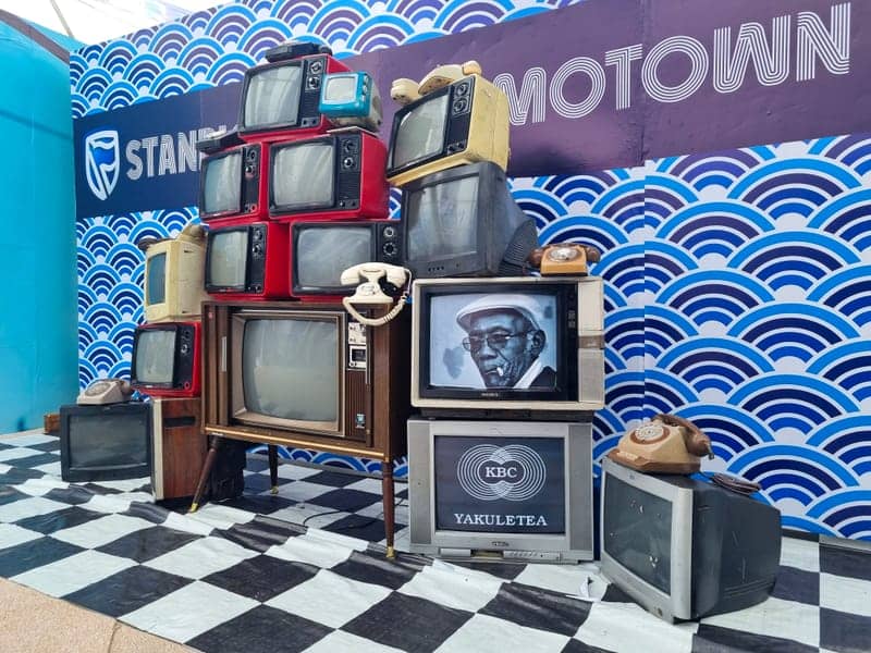 Cover of the Stanbic Motown album: a retro prop wall of stacked vintage TVs and rotary phones on a Stanbic Motown backdrop